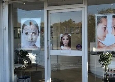 Front of Farrah Brows & Aesthetic at SkinFit Clinic, Hampton, with beautiful posters displayed.