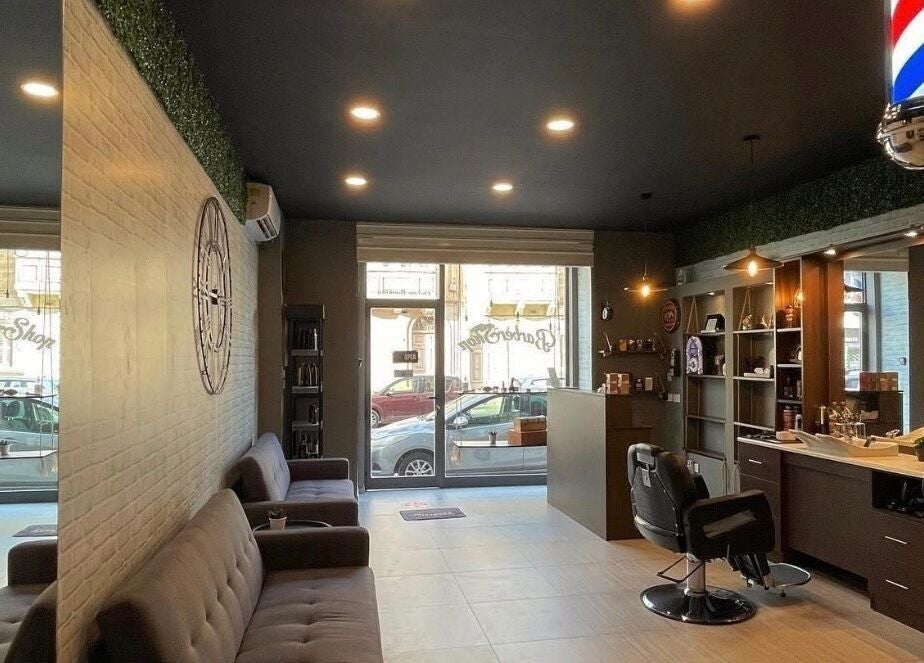 Interior of Terribile Barber Shop in Birkirkara, MT featuring sleek seating and a classic barber chair.