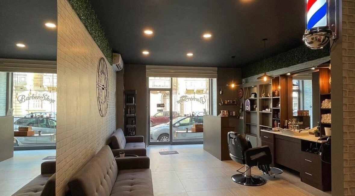 Interior of Terribile Barber Shop in Birkirkara, MT featuring sleek seating and a classic barber chair.