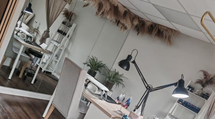 Chic treatment room at Silk Skin & Wellness Clinic, Hoveton, England, GB, featuring elegant decor and modern furniture.
