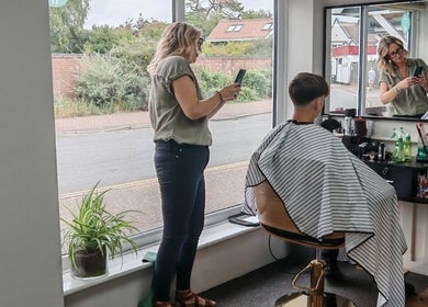 Stylist taking a photo of a client at Silk Skin & Wellness Clinic in Hoveton, England, GB.