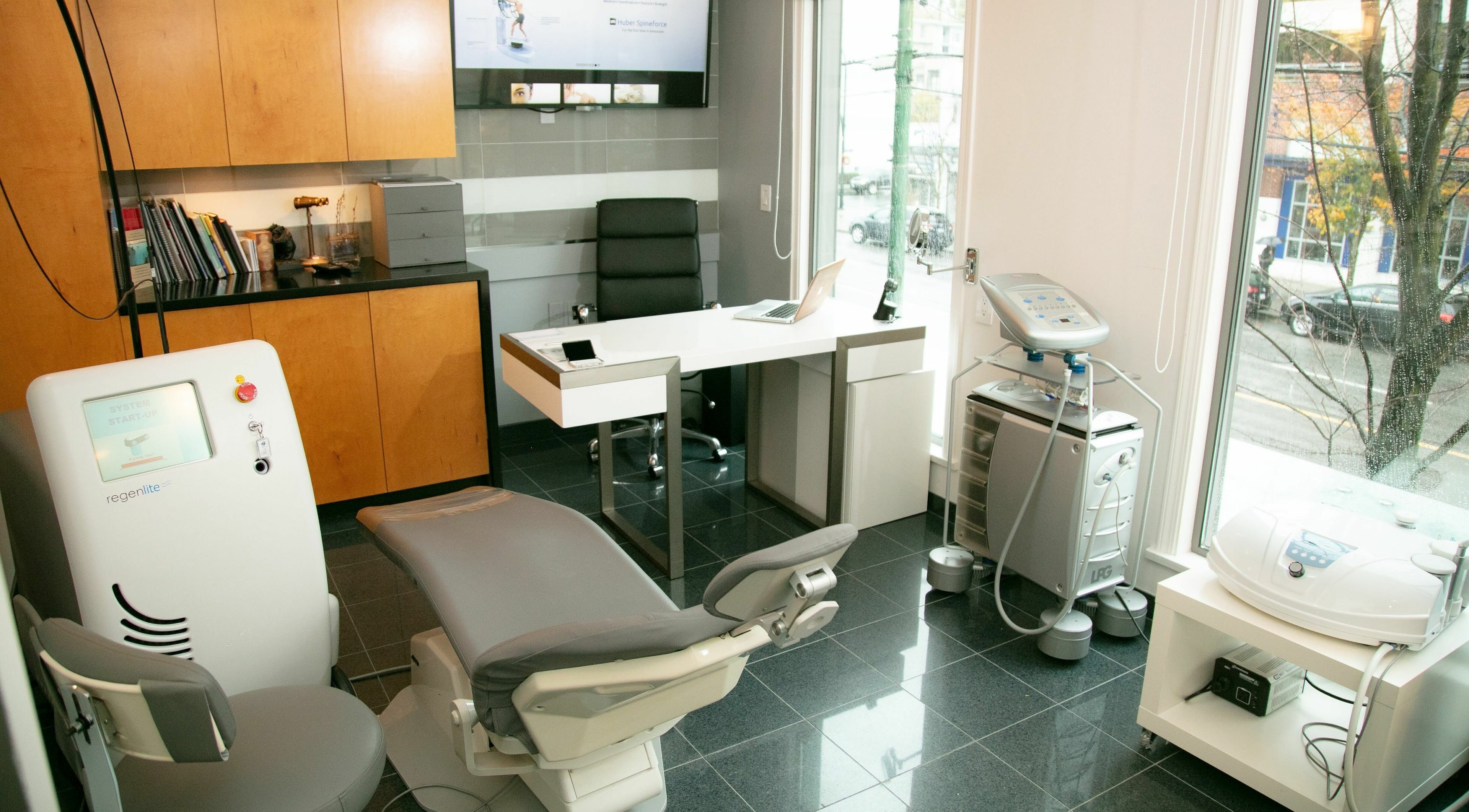 Modern treatment room at Paad Wellness and Derm Esthetics, Vancouver, BC, equipped for facial therapies.