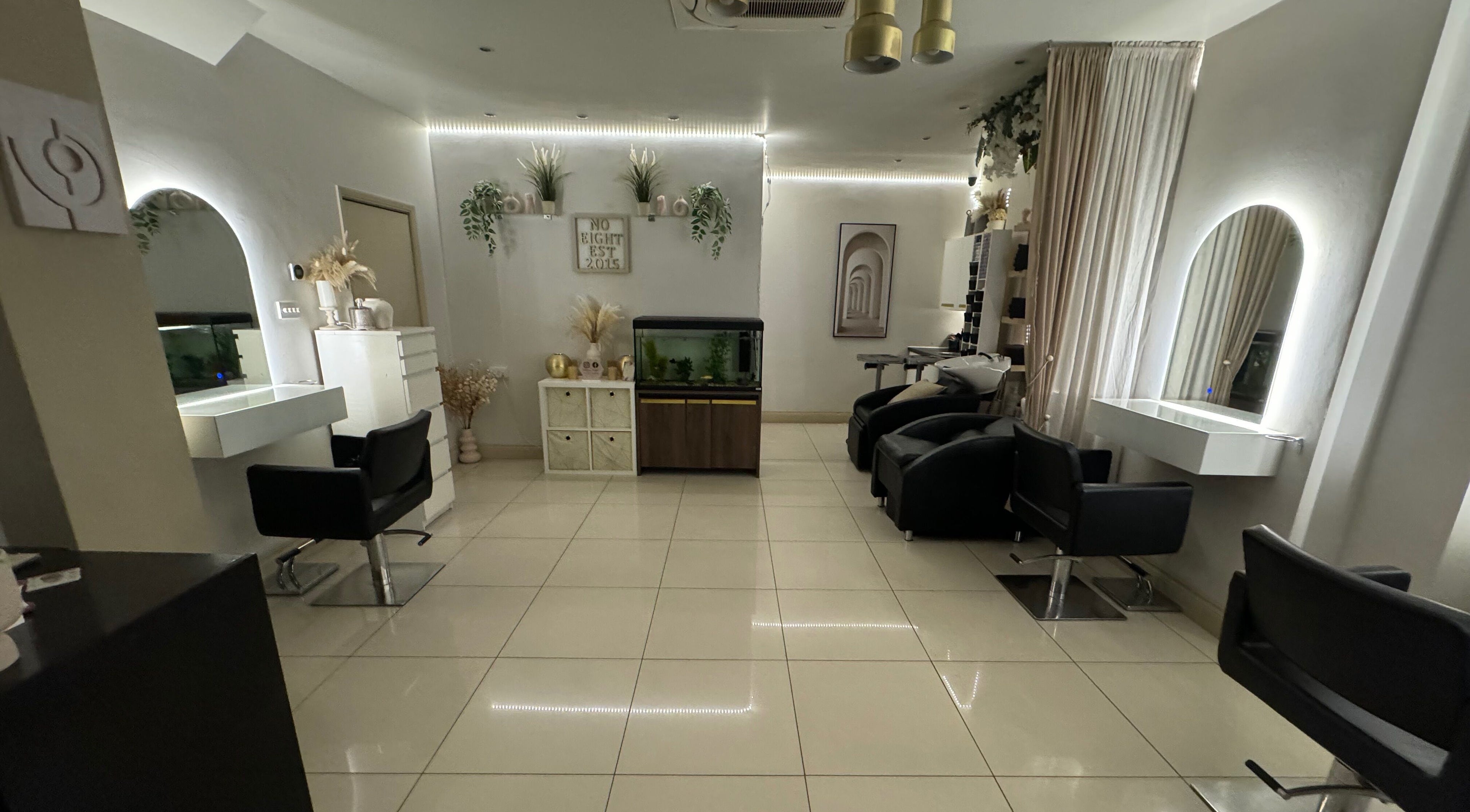 Elegant interior of Salon No.Eight in Esher, England, GB featuring stylish chairs and decor.