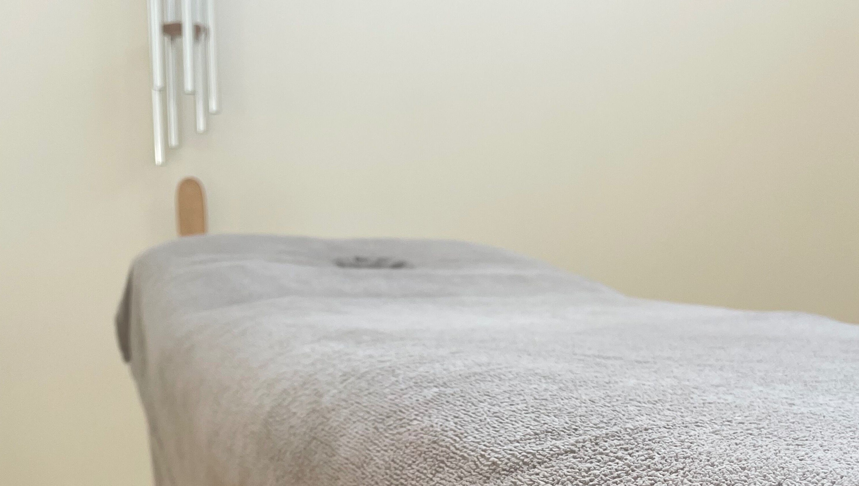 Cozy massage table at LC Beauty Lounge, Locks Heath, England, GB, ready for relaxation.