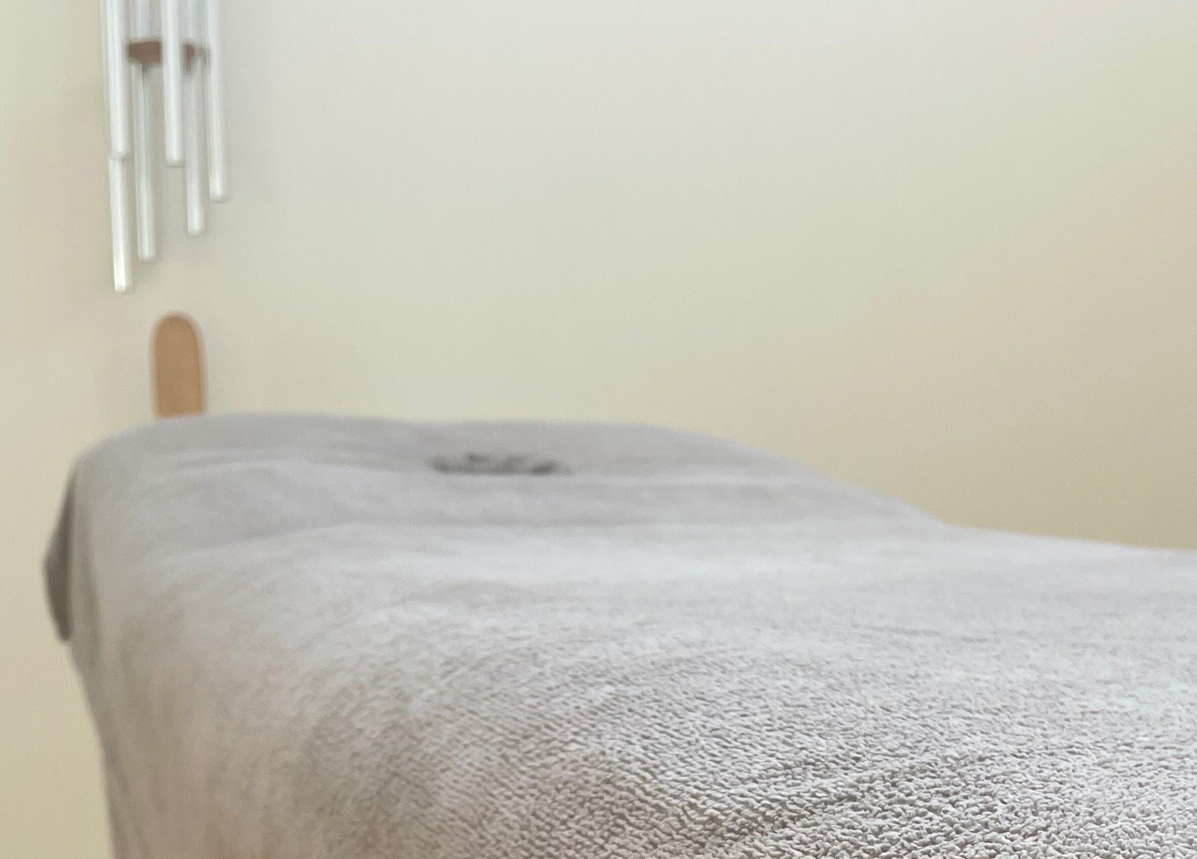 Cozy massage table at LC Beauty Lounge, Locks Heath, England, GB, ready for relaxation.