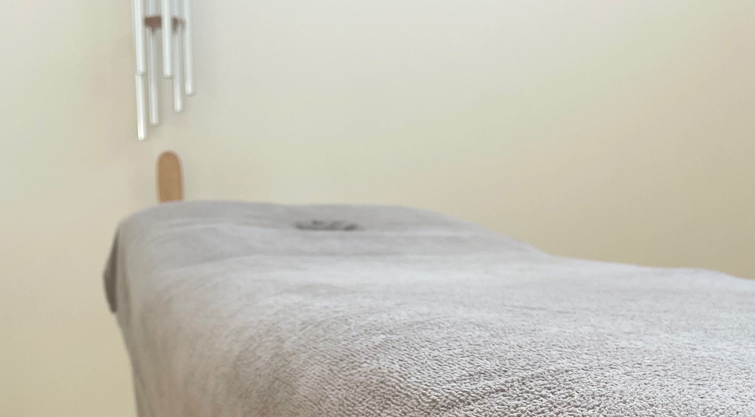 Cozy massage table at LC Beauty Lounge, Locks Heath, England, GB, ready for relaxation.