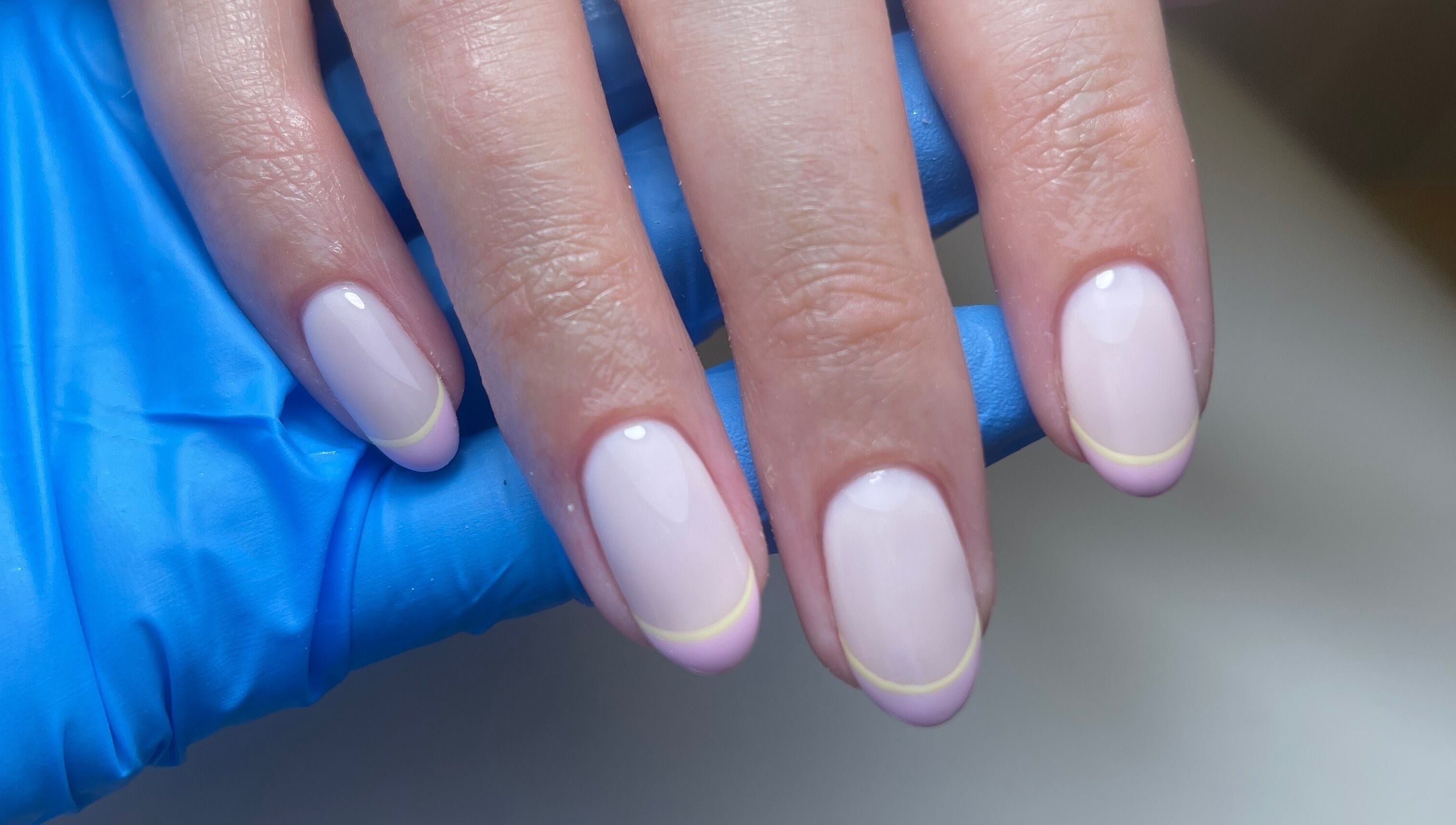 Elegant nails with pastel tips at By Demi, Belfast, Northern Ireland, GB. A perfect blend of style and care.