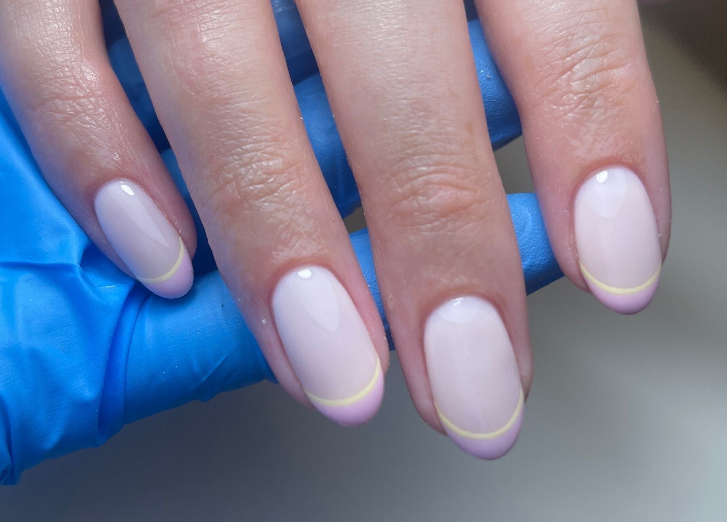 Elegant nails with pastel tips at By Demi, Belfast, Northern Ireland, GB. A perfect blend of style and care.