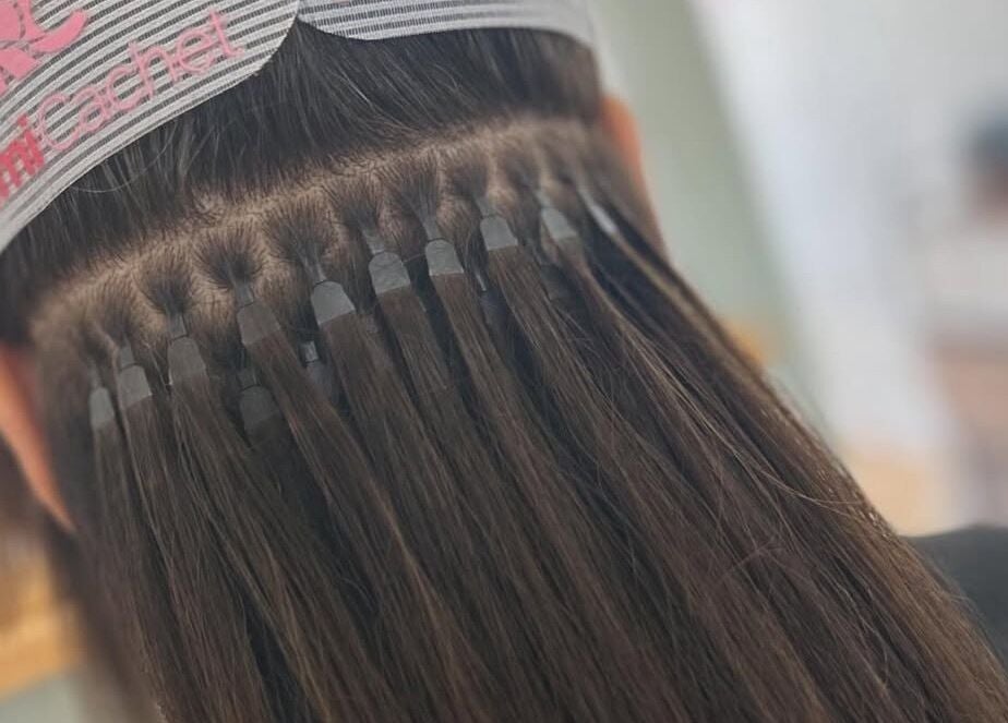 Close-up of hair extensions at The Hair Studio in Sudbury, England, GB showcasing expert styling.