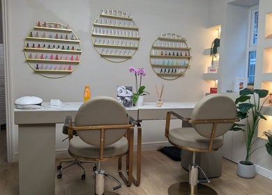 Chic manicure station at Aesthetically Yours, Poynton, England, GB with decor and nail polish display.