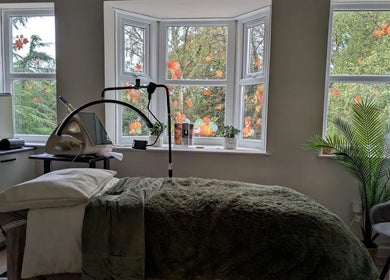 Relaxing treatment room at Aesthetically Yours in Poynton, England, GB with serene decor and natural light.