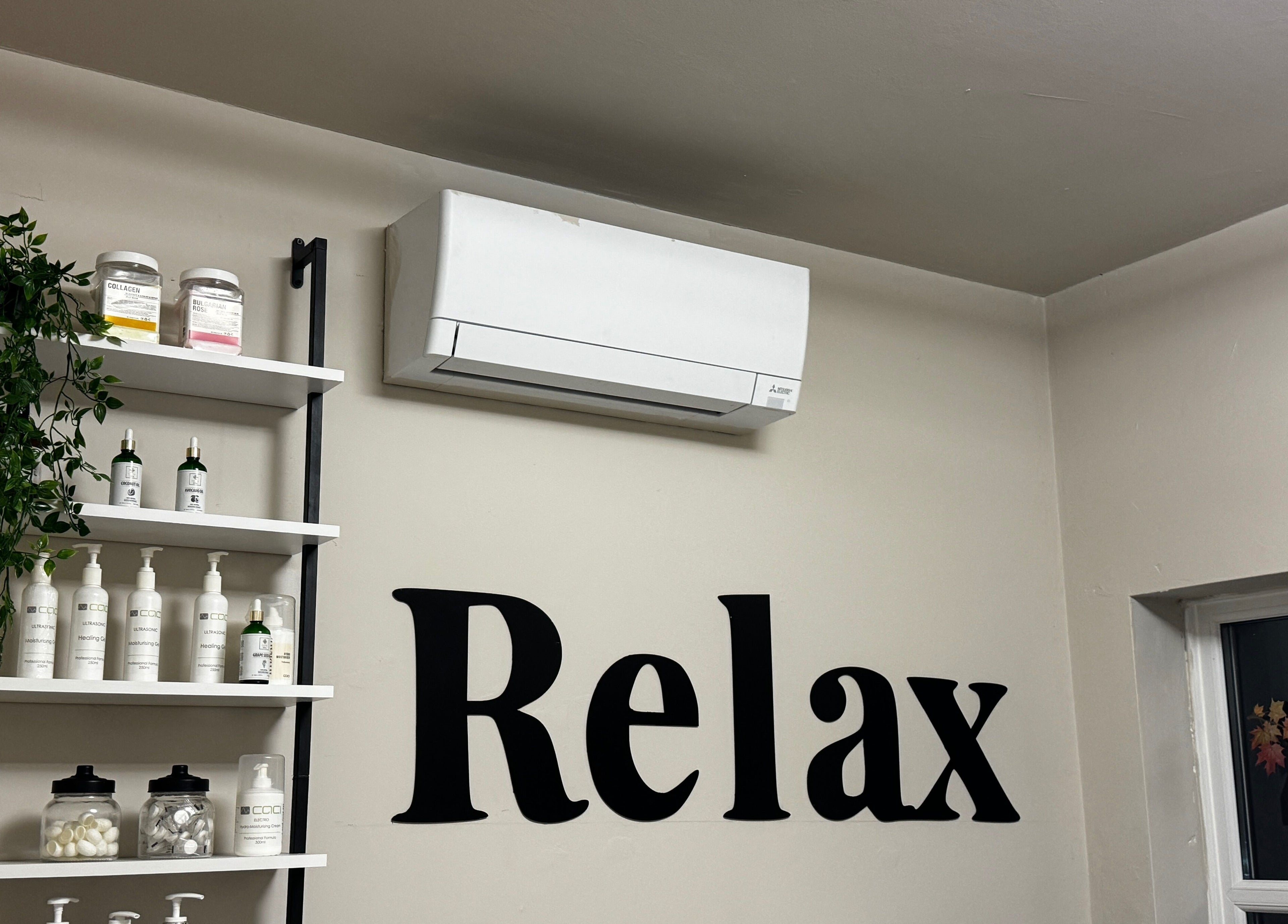 Relaxation area with shelves in Aesthetically Yours, Poynton, England, GB, adorned with beauty products.
