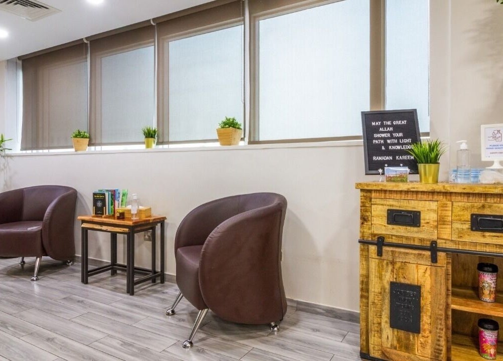 Welcoming seating area at La Poupee Home Service - Abu Dhabi, featuring modern decor and plants in Abu Dhabi, AE.