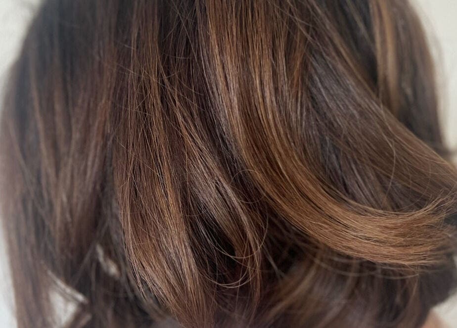 Close-up of styled brown hair at Frankie Artistry in Great Missenden, England, GB.