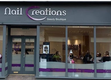 Front view of Nailcreations beauty boutique in Dunfermline, Scotland, GB, showcasing elegant window displays.