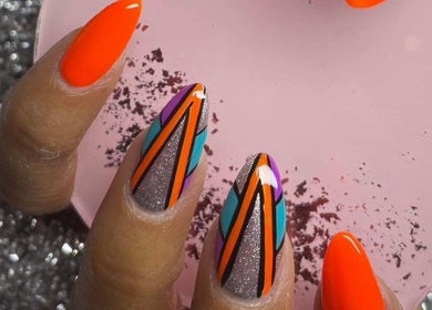 Vibrant geometric nail art design at Nailcreations, Dunfermline, Scotland, GB showcasing bright, bold colors.