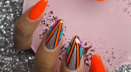Vibrant geometric nail art design at Nailcreations, Dunfermline, Scotland, GB showcasing bright, bold colors.