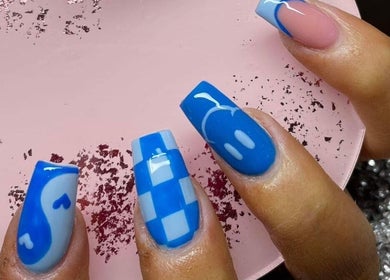 Stylish blue and pink nail art showcased at Nailcreations, Dunfermline, Scotland, GB.