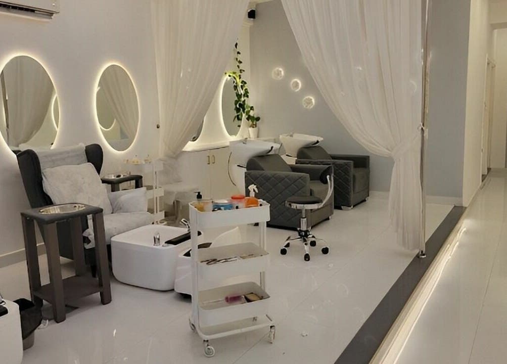 Elegant interior of Antheia Enhance salon in Dehradun, Uttarakhand, IN with modern decor and plush seating.