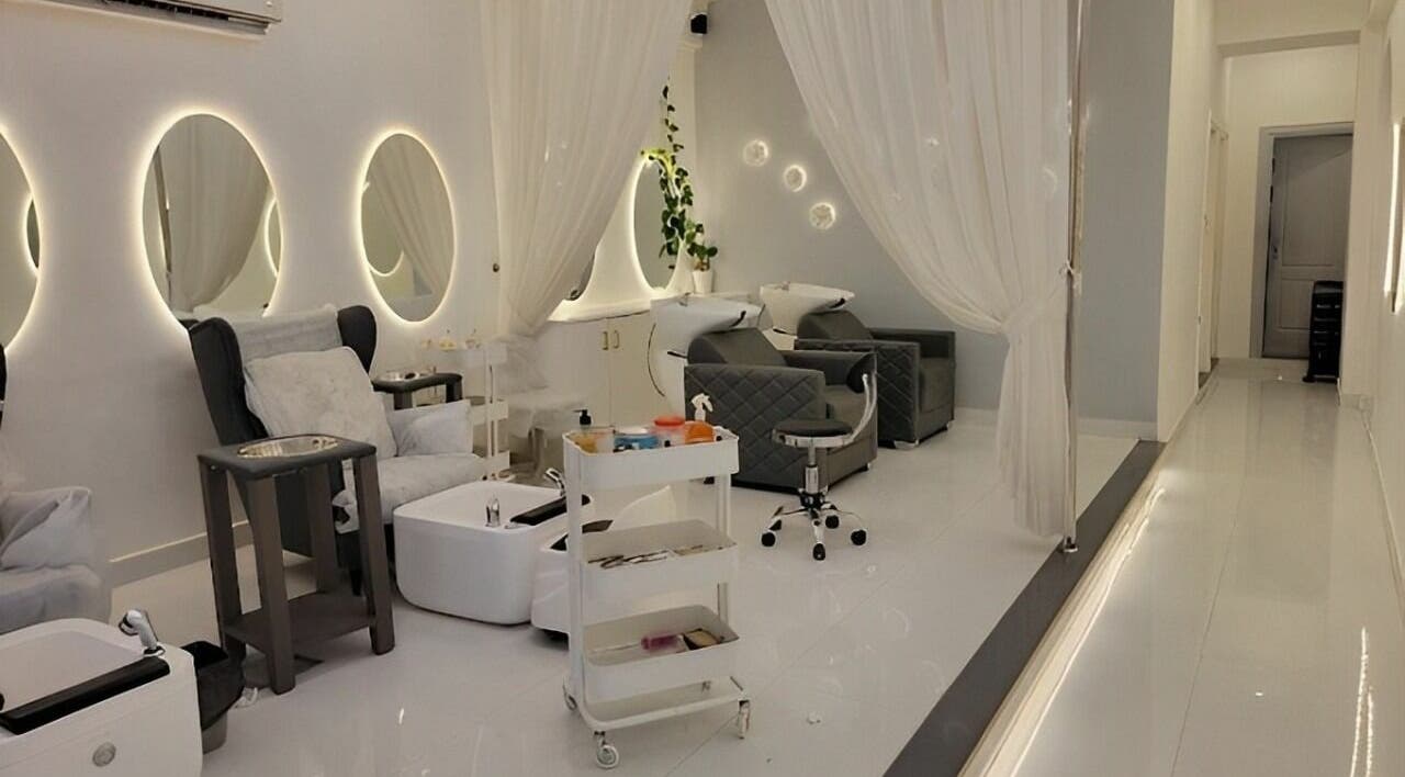Elegant interior of Antheia Enhance salon in Dehradun, Uttarakhand, IN with modern decor and plush seating.