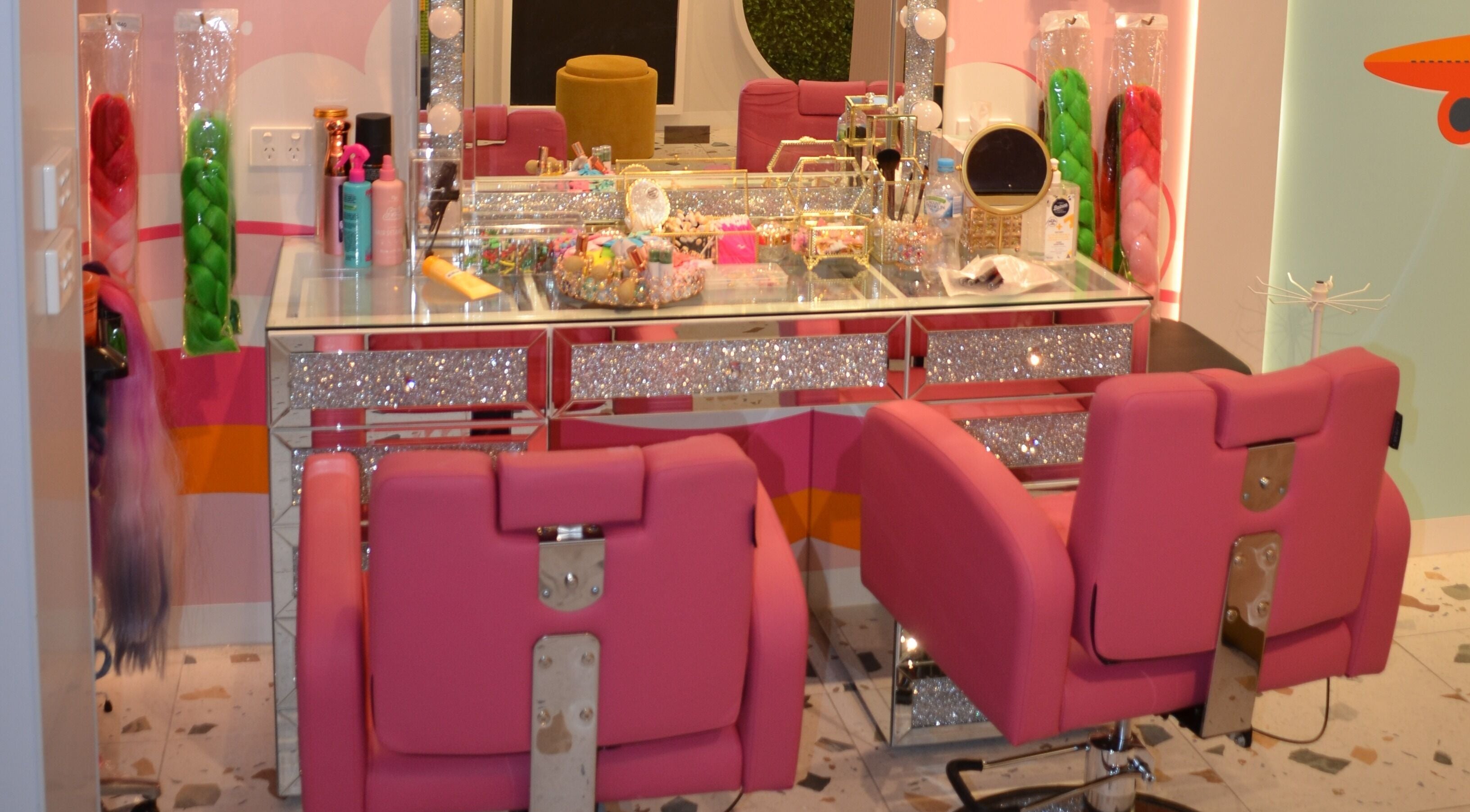 StarKids Salon Spa | Parkmore in Keysborough, Victoria, AU features a glittering workstation with pink chairs and beauty tools.