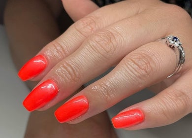 Close-up of vivid red nails at Serenity Beauty and Skincare Salon Ltd, Llangefni, North Wales, GB.