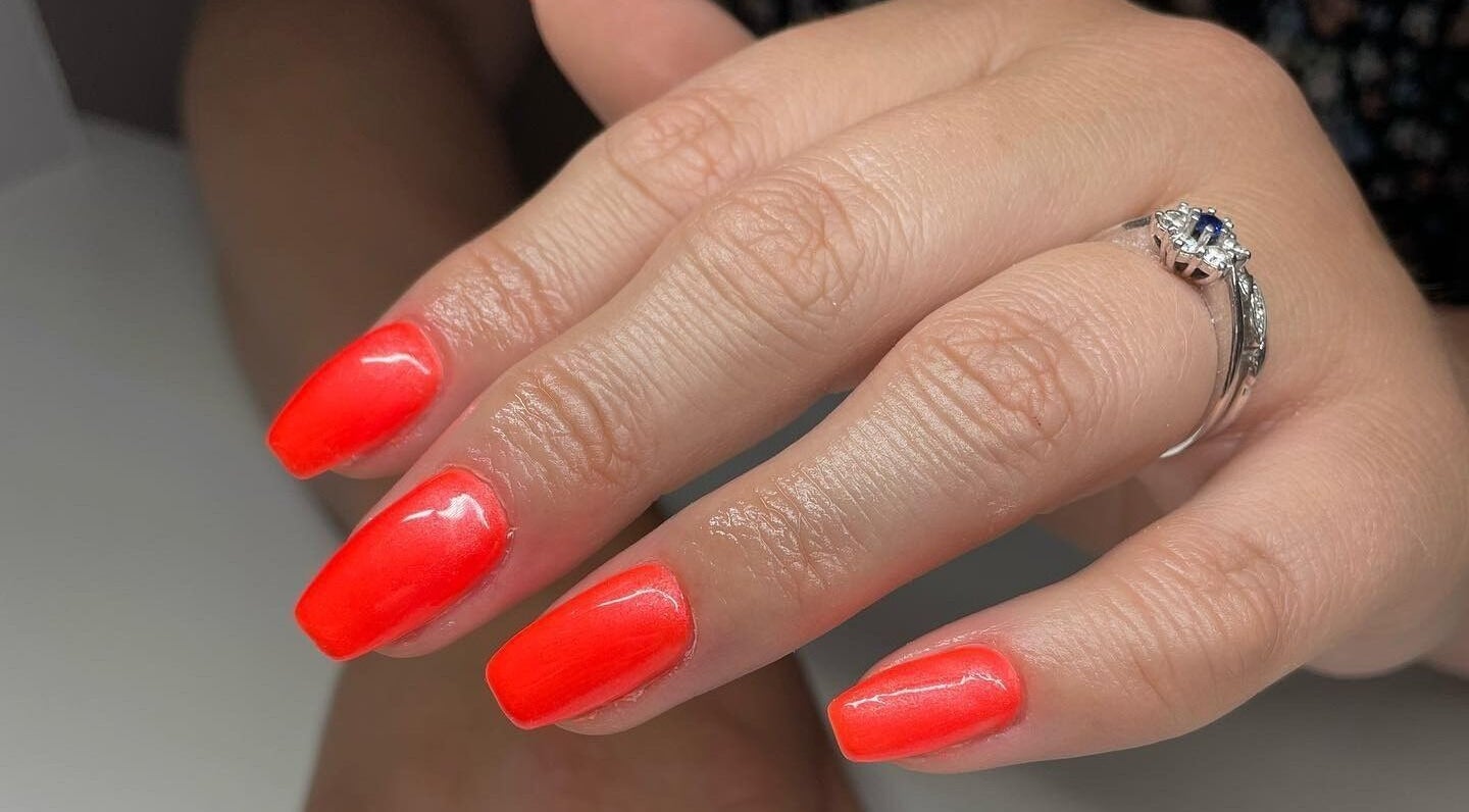 Close-up of vivid red nails at Serenity Beauty and Skincare Salon Ltd, Llangefni, North Wales, GB.
