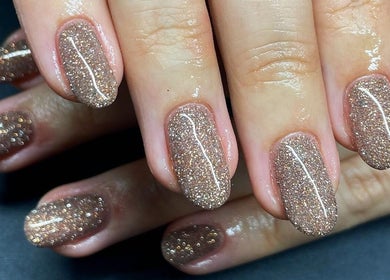 Glittery nails in Llangefni, North Wales at Serenity Beauty and Skincare Salon Ltd, showcasing expert nail artistry.