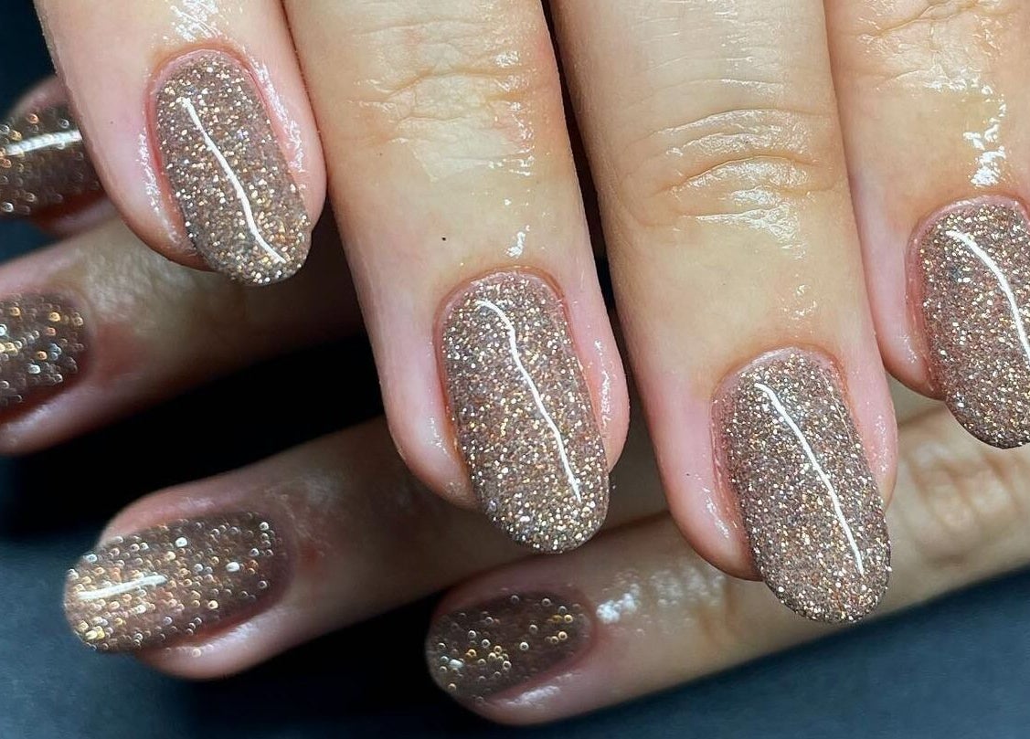 Glittery nails in Llangefni, North Wales at Serenity Beauty and Skincare Salon Ltd, showcasing expert nail artistry.