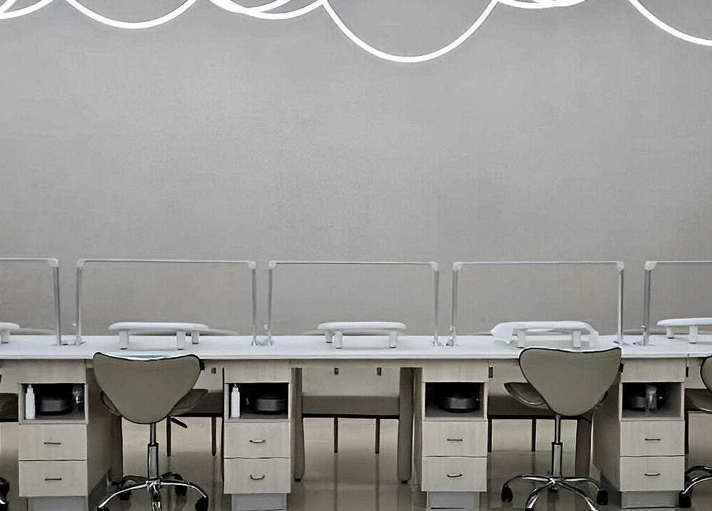 Modern nail stations at Society 1840, Johannesburg, Gauteng, ZA, offering stylish beauty services.