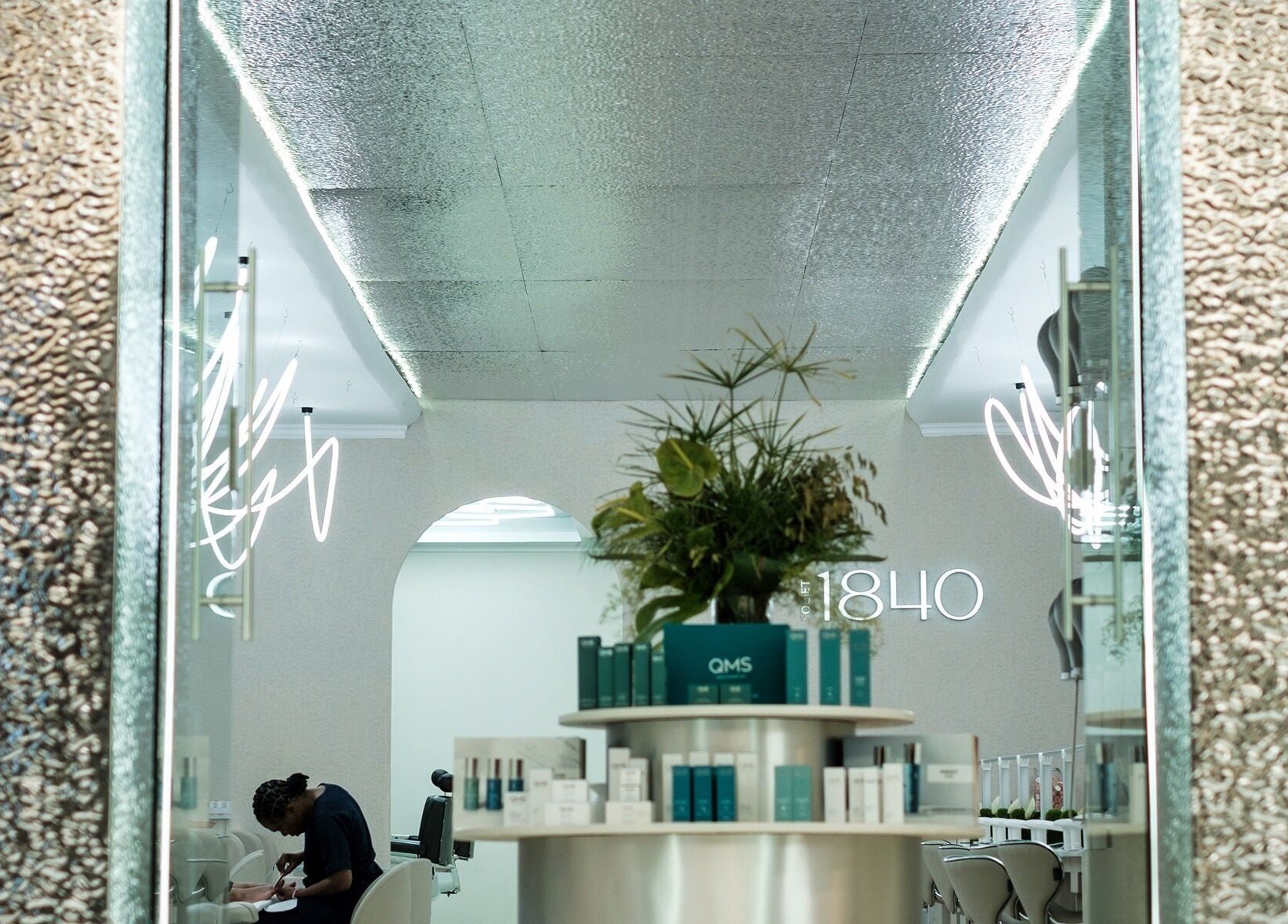 Elegant entry of Society 1840 in Johannesburg, Gauteng, ZA, featuring modern decor and lush indoor plants.