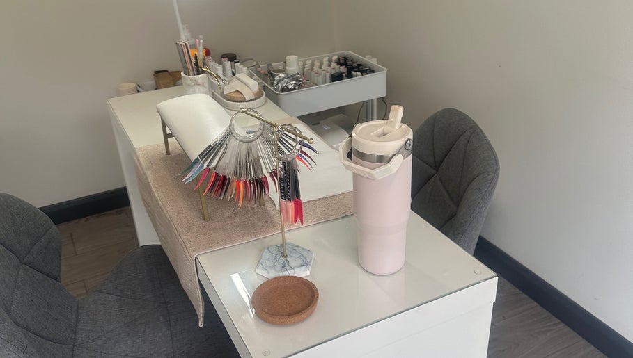 Nail station at Elle Louise Beauty in Watnall, England, GB, with vibrant polish samples.