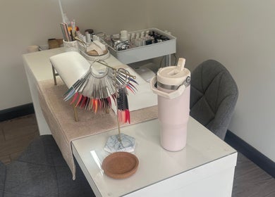 Nail station at Elle Louise Beauty in Watnall, England, GB, with vibrant polish samples.