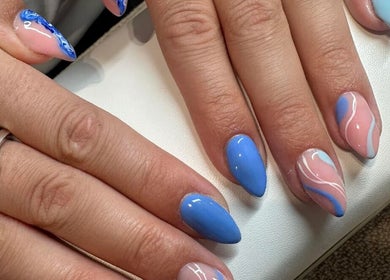 Colorful nail art design at Elle Louise Beauty in Watnall, England, GB featuring blue and pink hues.