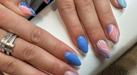 Colorful nail art design at Elle Louise Beauty in Watnall, England, GB featuring blue and pink hues.
