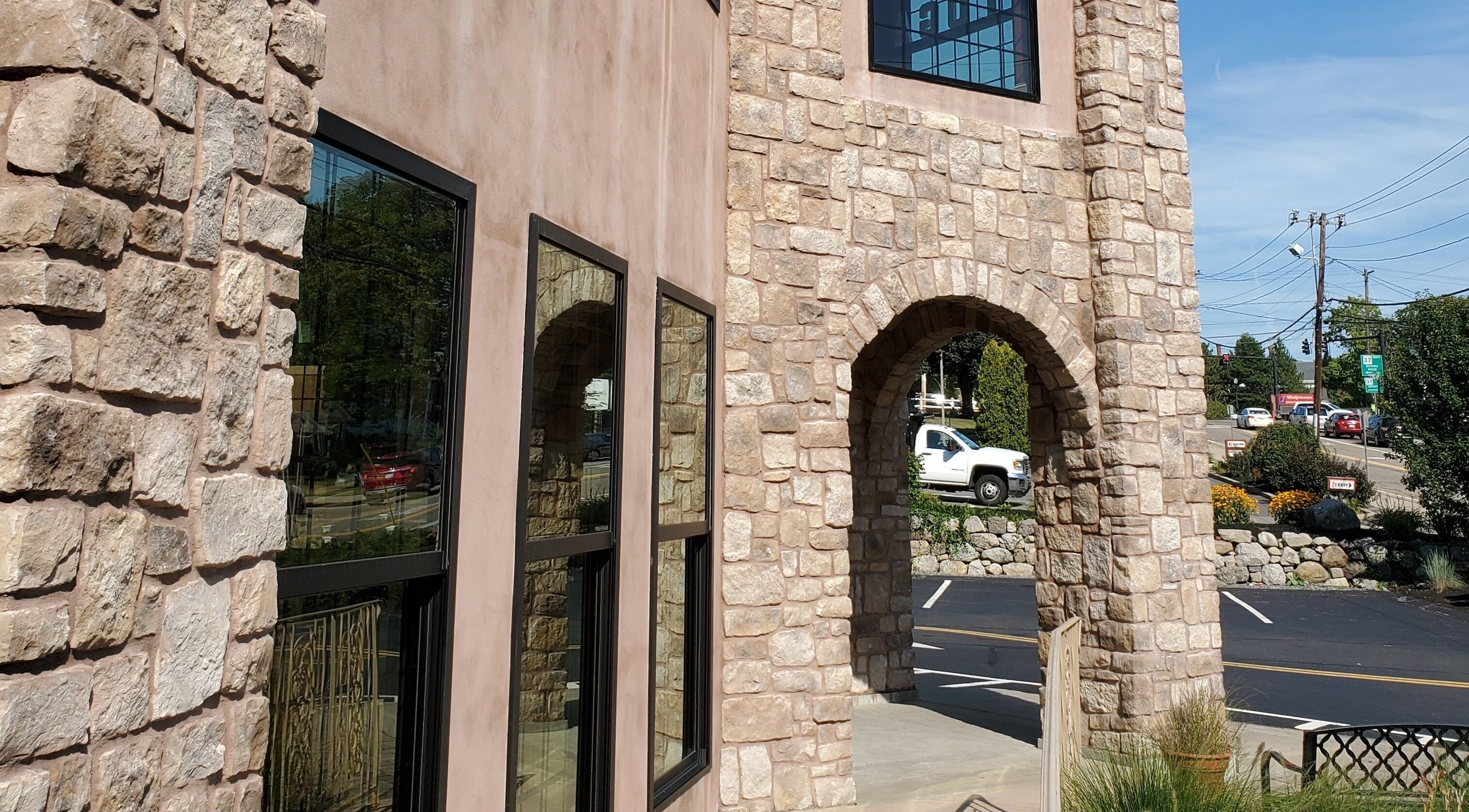 Joy Wellness for Life venue with stone facade located in Holbrook, Massachusetts, US, showcasing elegant architecture.