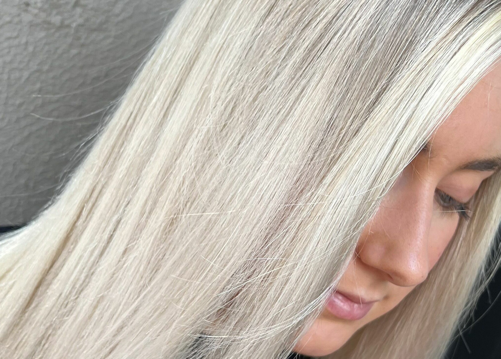 Close-up of silky blonde hair at Meika Salon by Brooke Repcen, Melbourne, Victoria, AU.