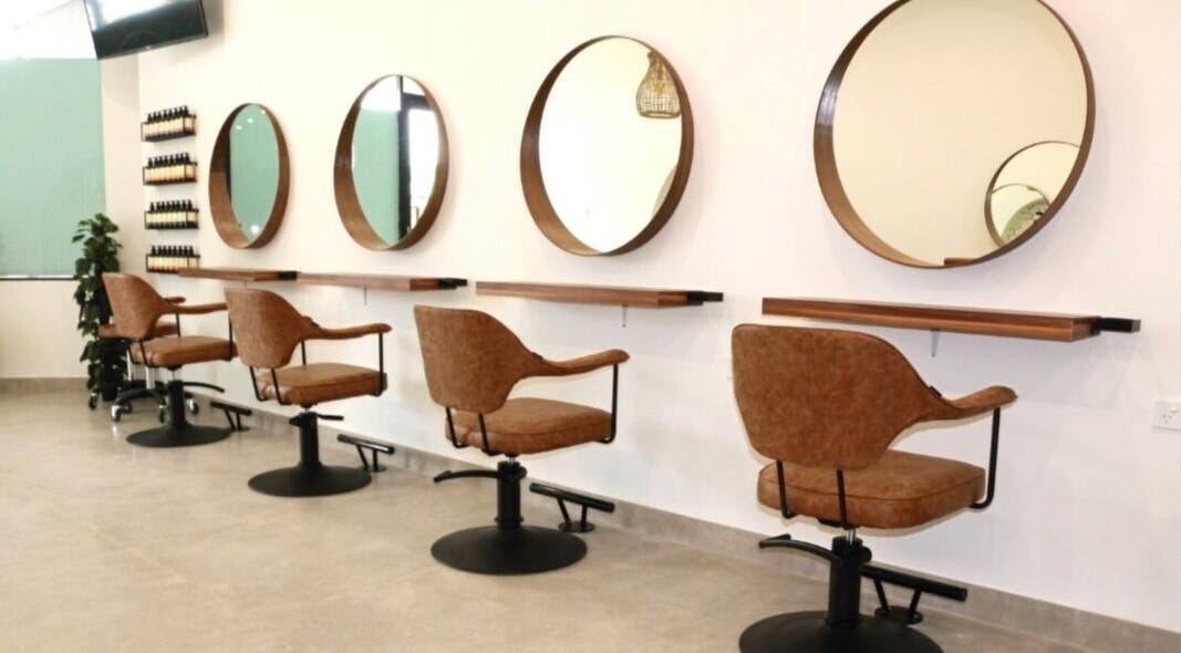 Modern salon chairs and mirrors at Minas Hair Salon, Roselands, New South Wales, AU.