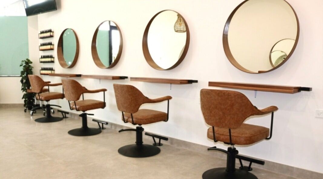 Modern salon chairs and mirrors at Minas Hair Salon, Roselands, New South Wales, AU.