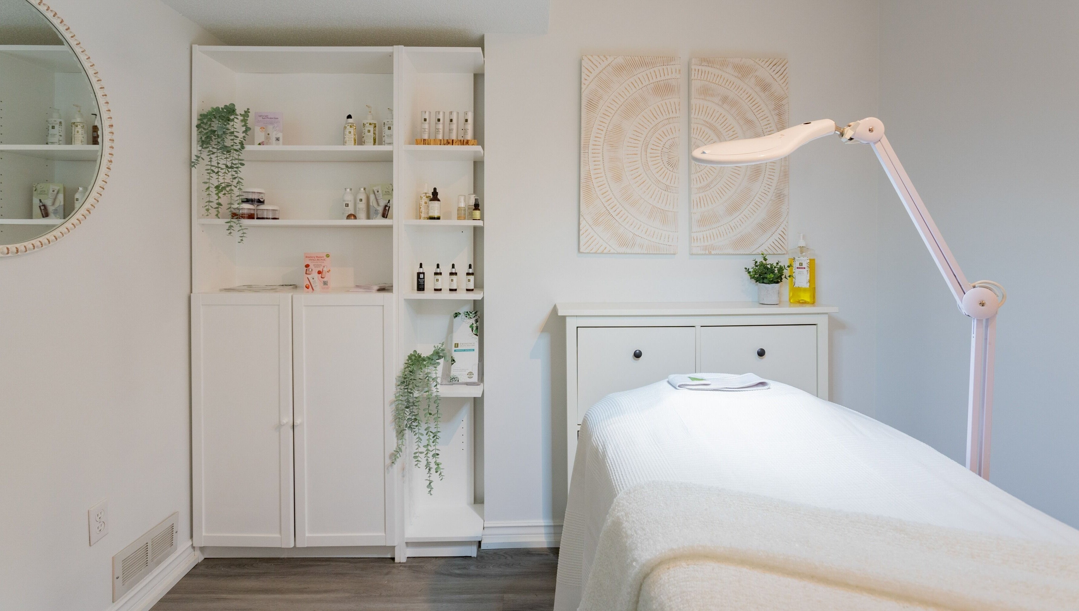Treatment room at Derma Luxe laser and skin in Cambridge, Ontario, CA, featuring skincare products and ambient decor.