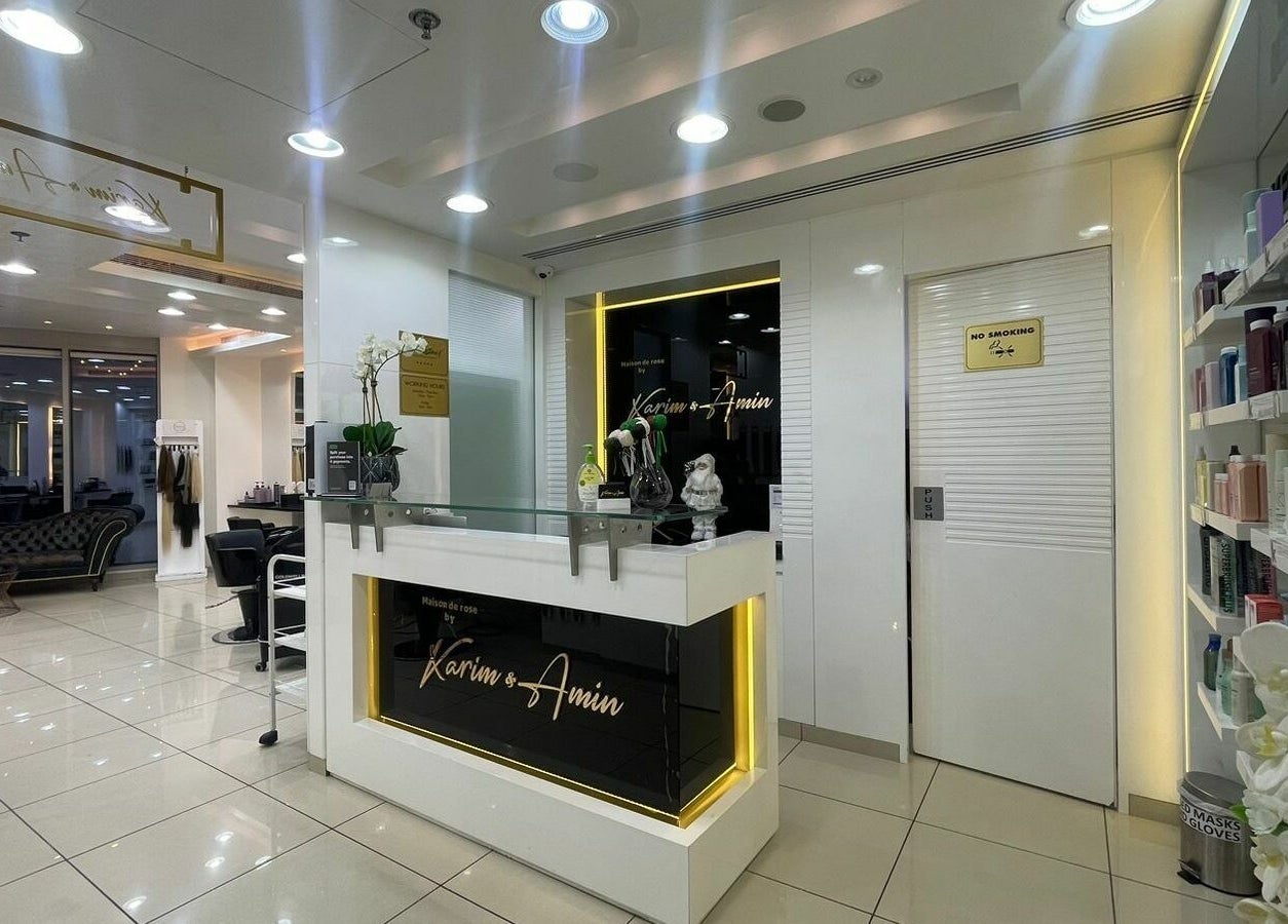 Chic reception at Karim and Amin Salon, Dubai, Dubai, AE, showcasing modern interior design and beauty products.