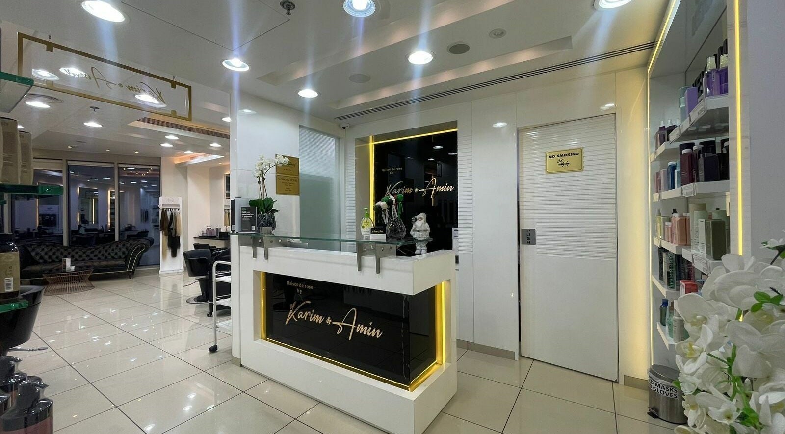 Chic reception at Karim and Amin Salon, Dubai, Dubai, AE, showcasing modern interior design and beauty products.