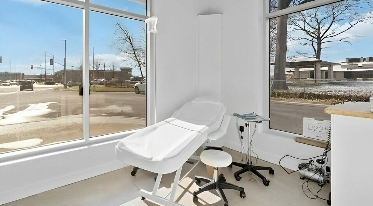 Bright treatment room at Nurse. Aesthetic & Holistic Clinic in Niagara Falls, Ontario, CA featuring a comfortable chair.