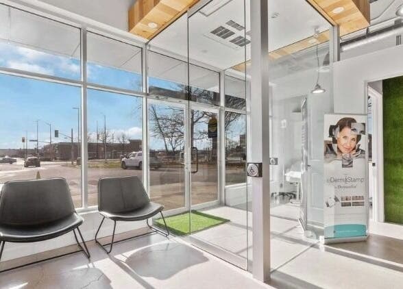 Bright interior of Nurse. Aesthetic & Holistic Clinic, Niagara Falls, Ontario, CA with large windows and seating.
