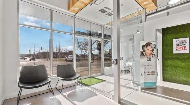 Bright interior of Nurse. Aesthetic & Holistic Clinic, Niagara Falls, Ontario, CA with large windows and seating.