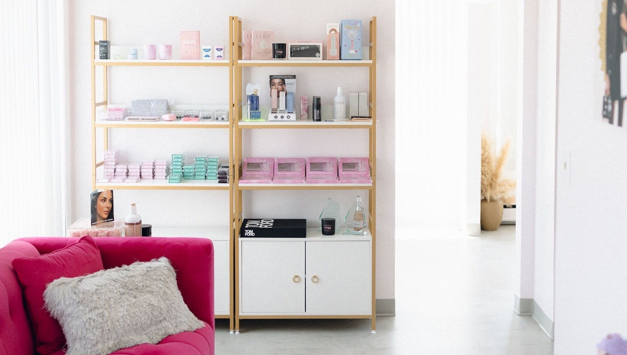 Elegant beauty display at Lashed By Mir, Sault Ste. Marie, Ontario, CA, featuring products on stylish shelves.