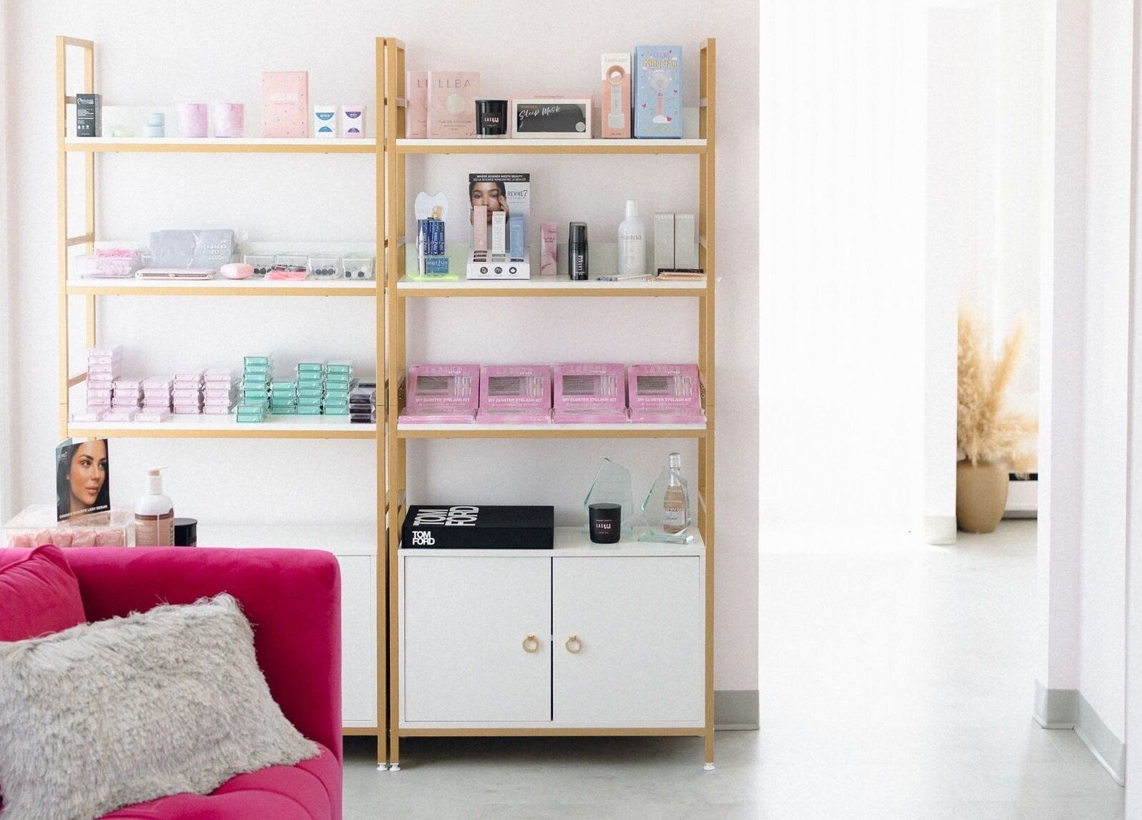 Elegant beauty display at Lashed By Mir, Sault Ste. Marie, Ontario, CA, featuring products on stylish shelves.