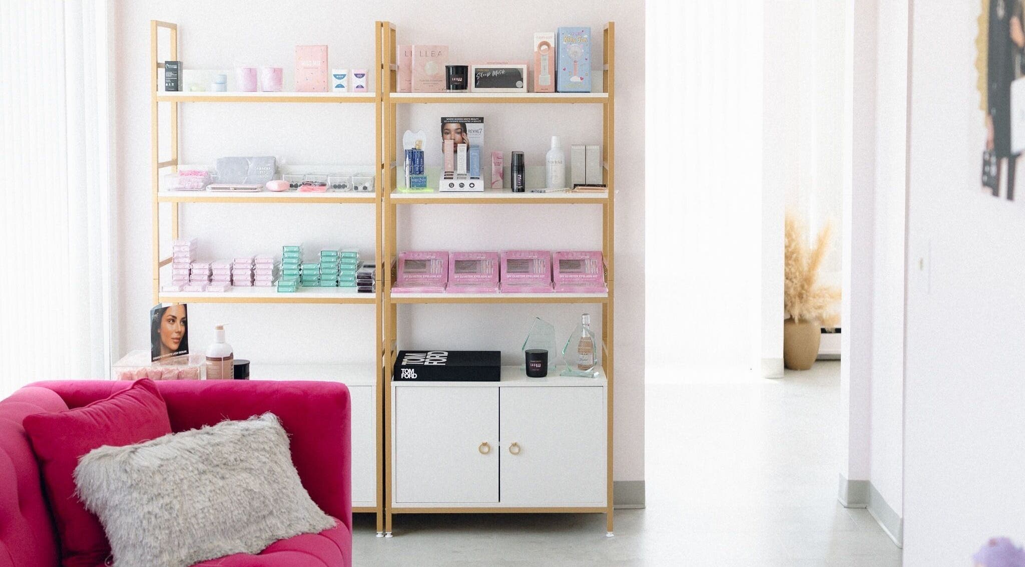 Elegant beauty display at Lashed By Mir, Sault Ste. Marie, Ontario, CA, featuring products on stylish shelves.