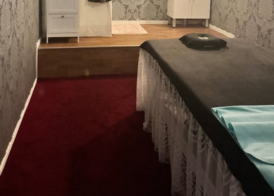 Cozy massage room at Aroma Massage, Auckland, Auckland, NZ, featuring a comfortable massage table.