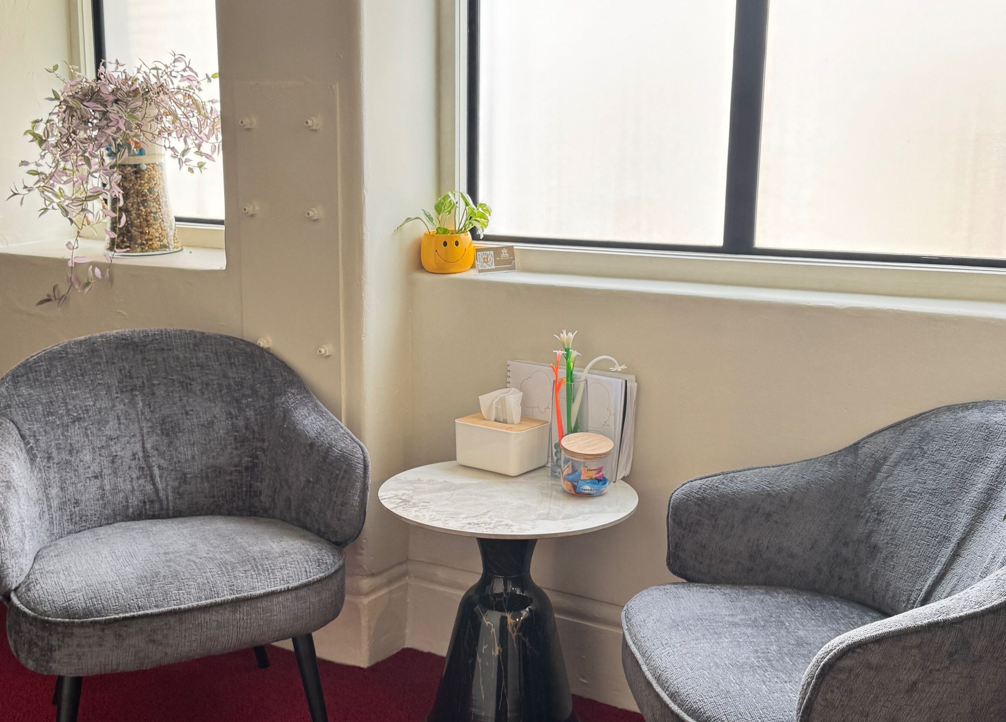 Relaxing seating area at Aroma Massage in Auckland, Auckland, NZ with plush chairs and decor.